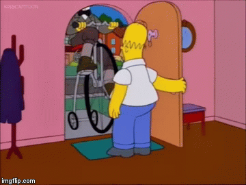 The_Simpsons_Boot_To_The_Head.gif